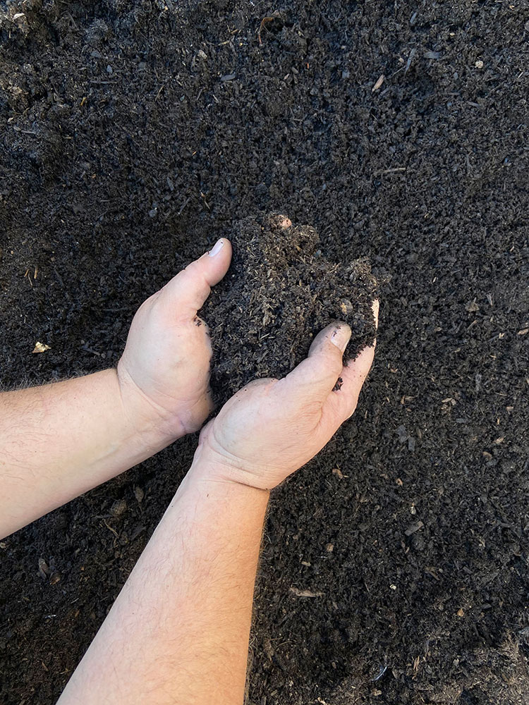 Image of child playing in Smith Brothers Mulch